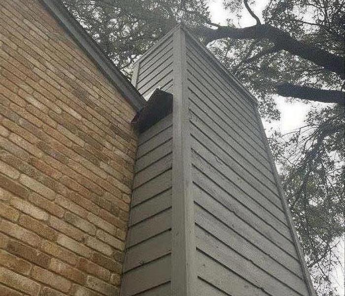 A chimney that needs repair on the top 