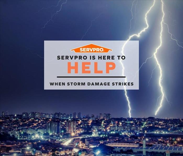 A sign that says SERVPRO is here to help when storm damage strikes
